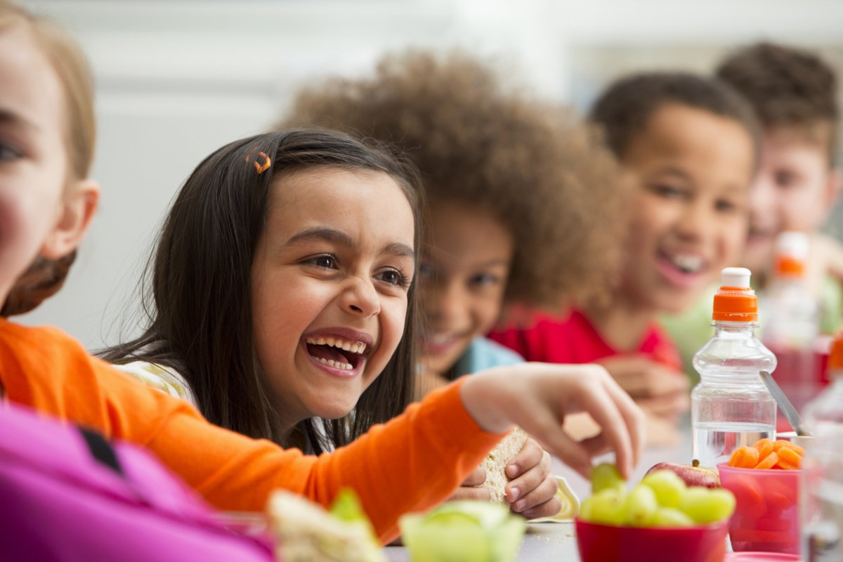 Students enjoying a healthy meal together at school